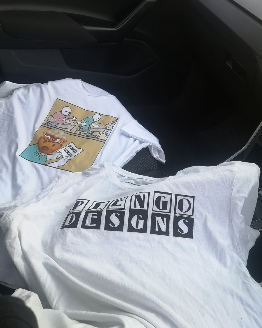 Two printed t-shirts, laid out after production.